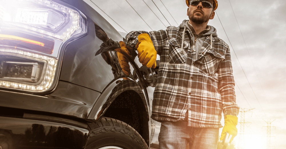 From DIYers to Professional Contractors What Size Pickup is Right for You man leaning on pickup truck